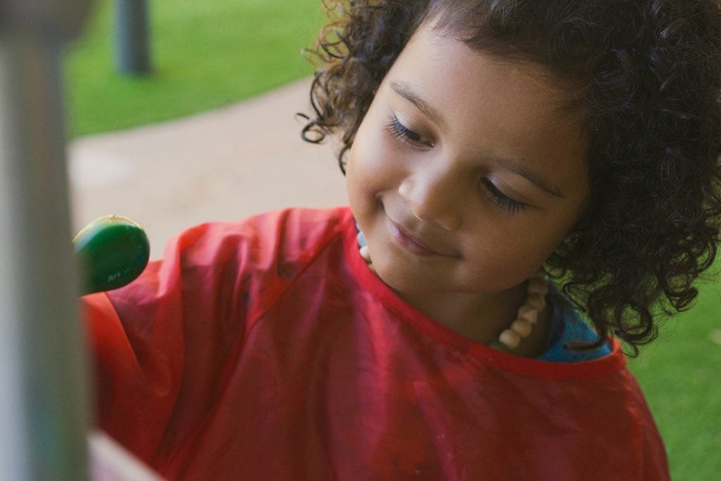 a girl painting at Story House Chirnside Park