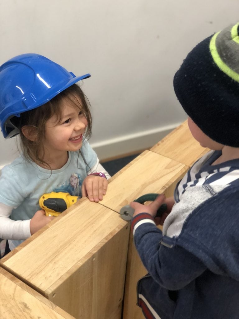 children playing with toy tools