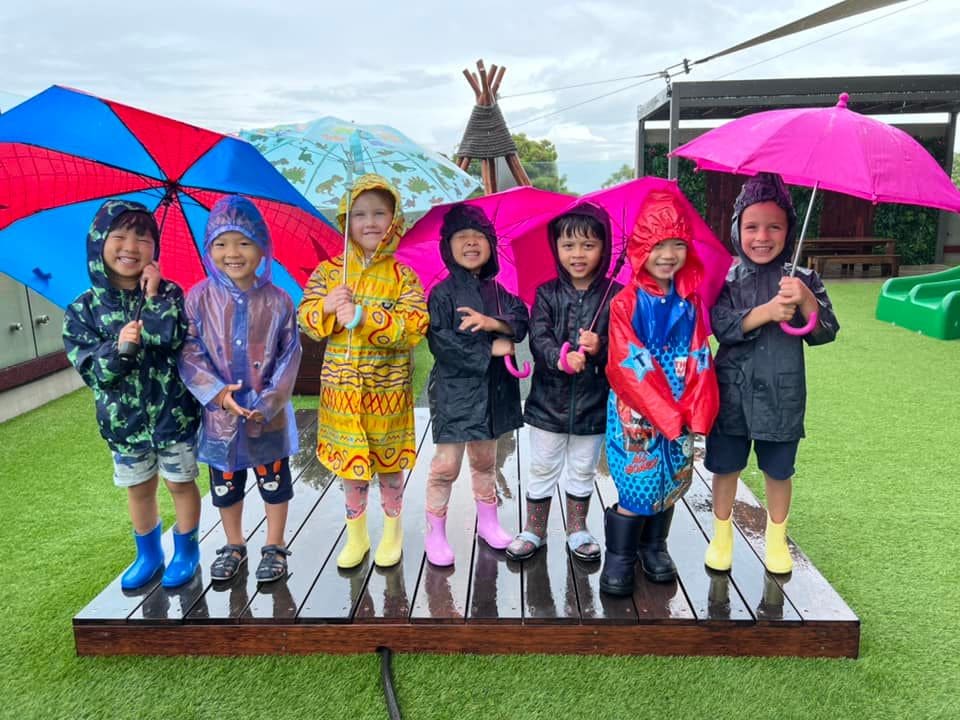 Mascot children enjoying outdoor play in all weathers