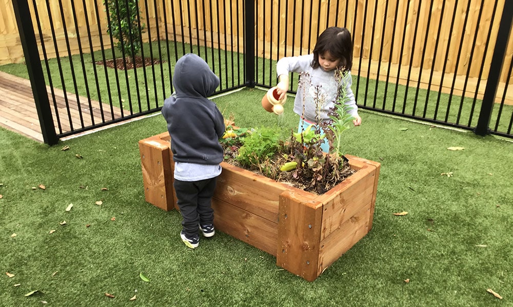 Children gardening at Noble Park childcare centre