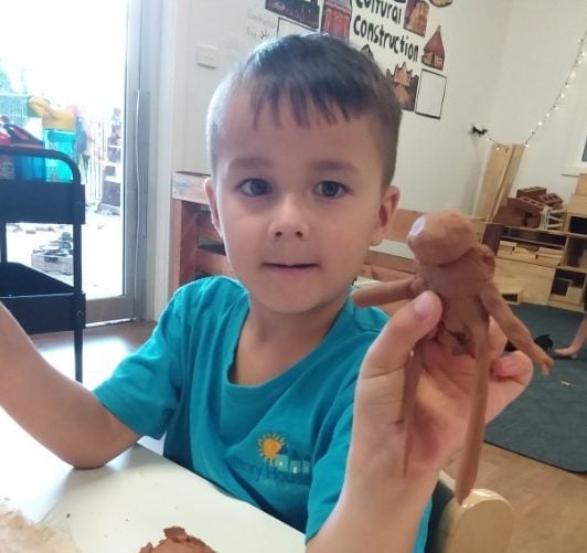 children playing with clay