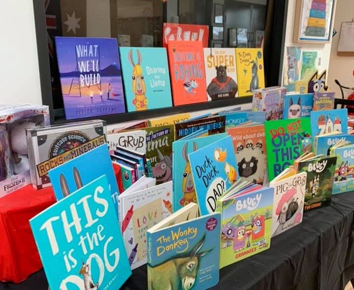 Books arranged on a table for the book fair