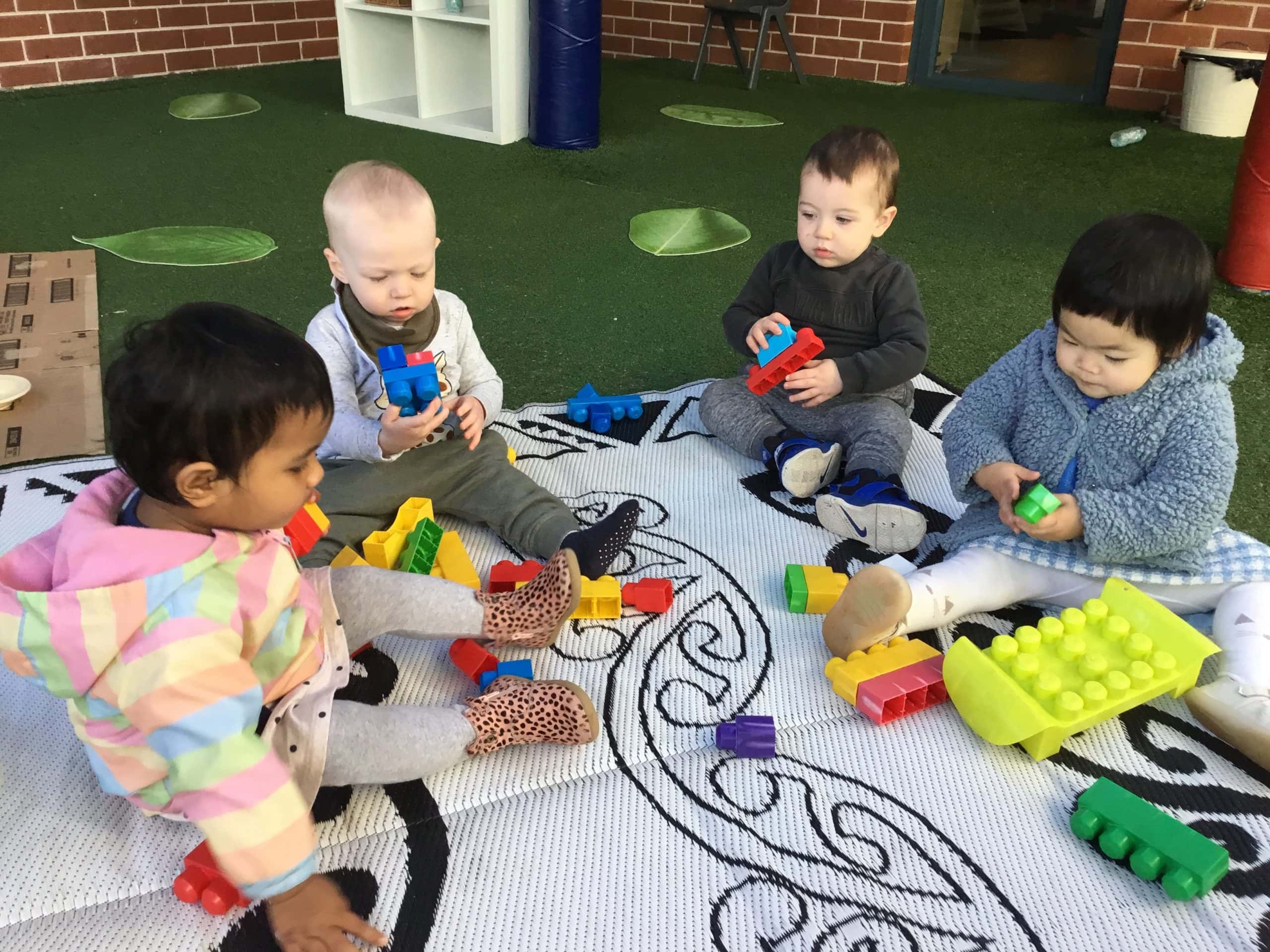 Nursery children enjoy construction with blocks at Story House Putney